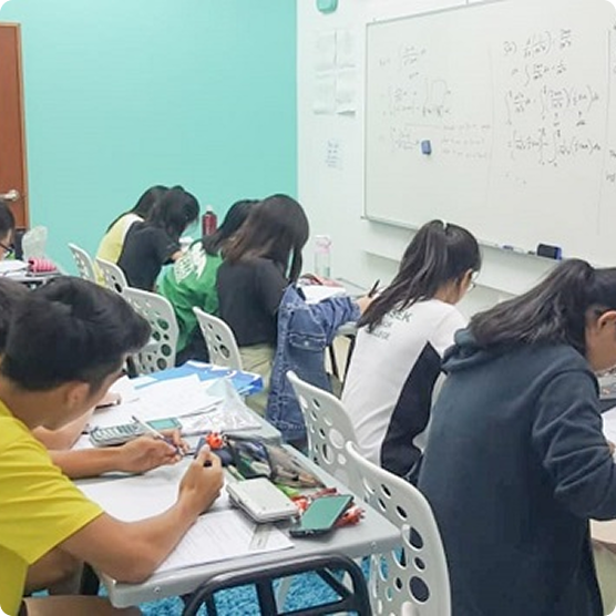 Students attending onsite H2 Math tuition class